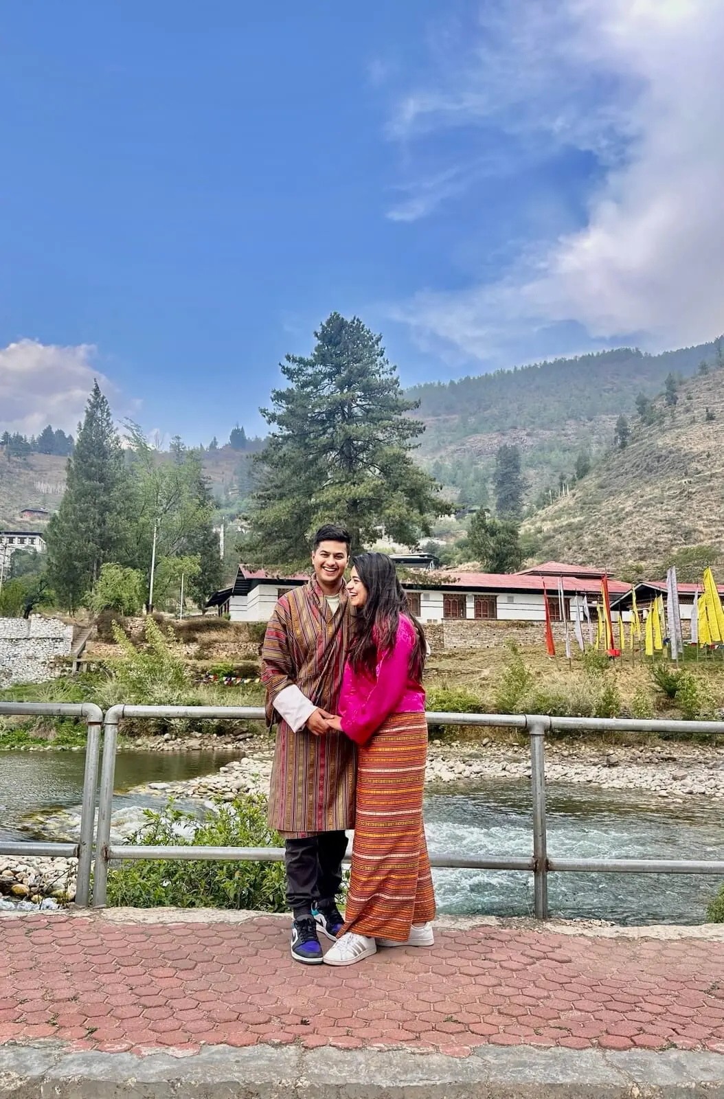 Couple beside a lake in the mountains