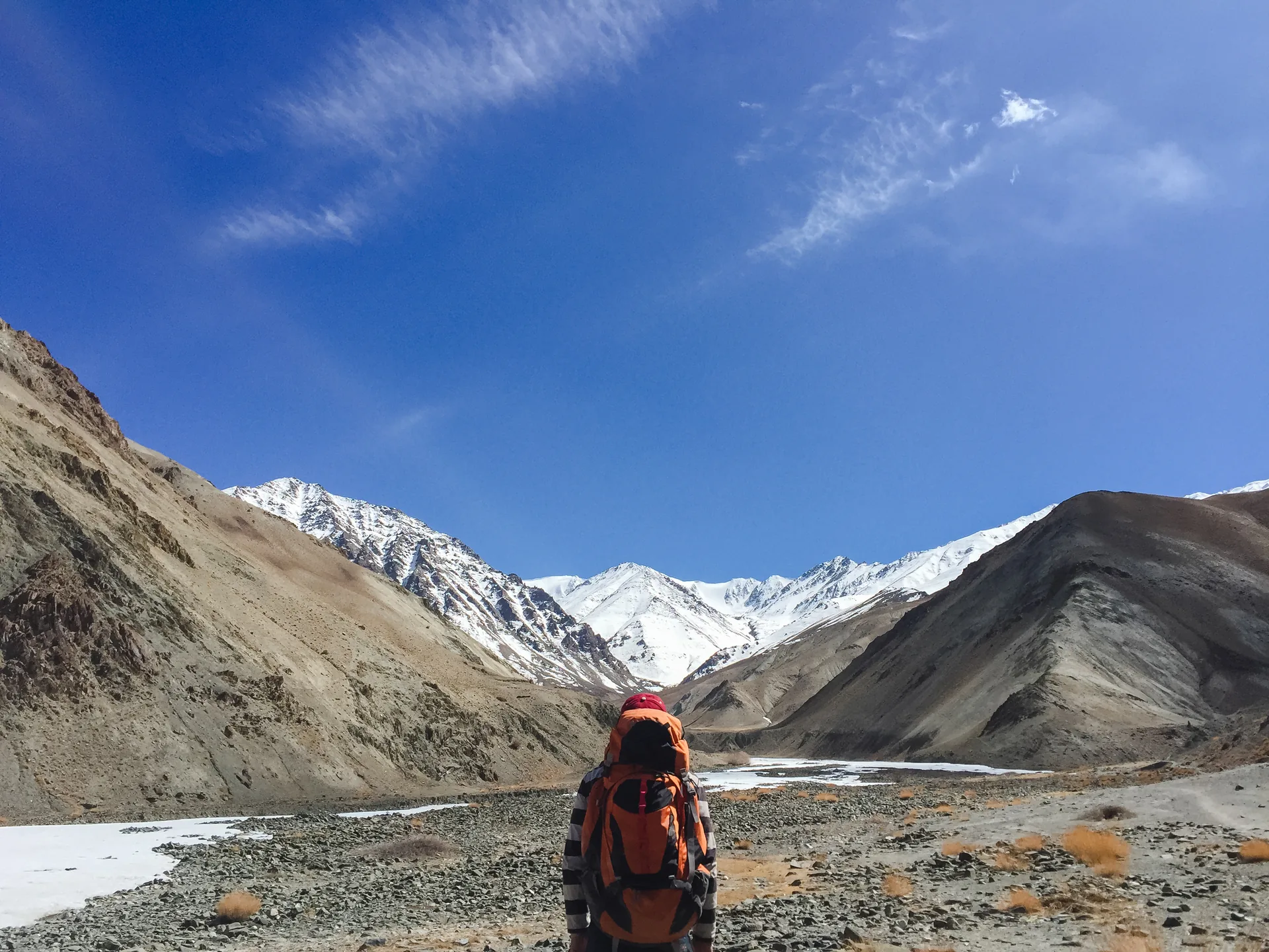 Hiker in a rocky mountain valley
