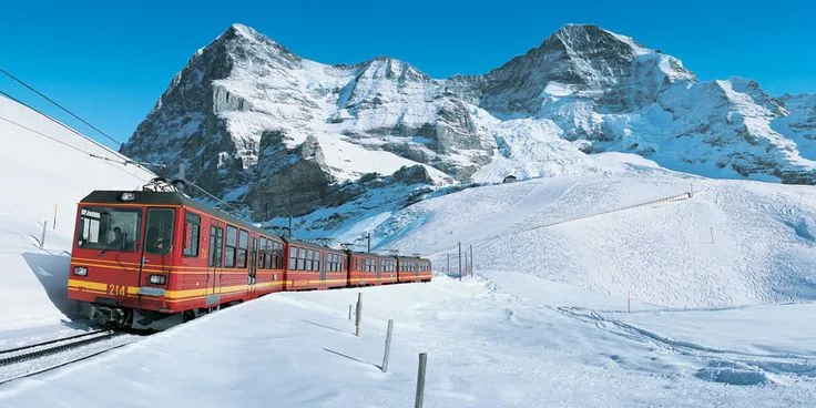 Train through snowy alpine scenery