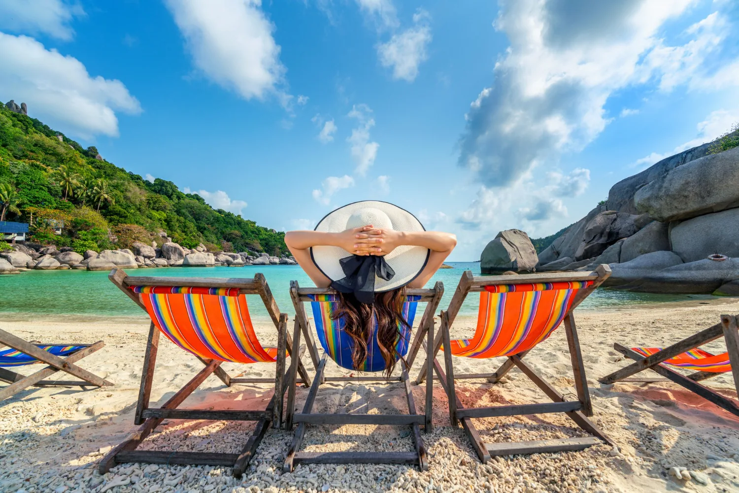 Traveller relaxing on a beach chair